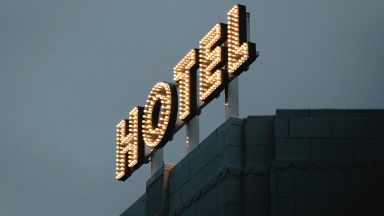 a large tower with a sign on top